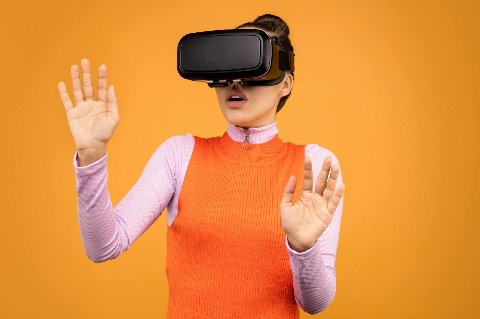 woman in long sleeve shirt wearing vr goggles