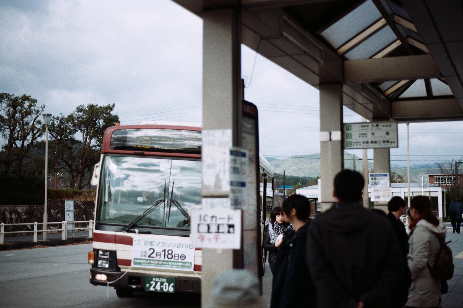 people standing near the bus